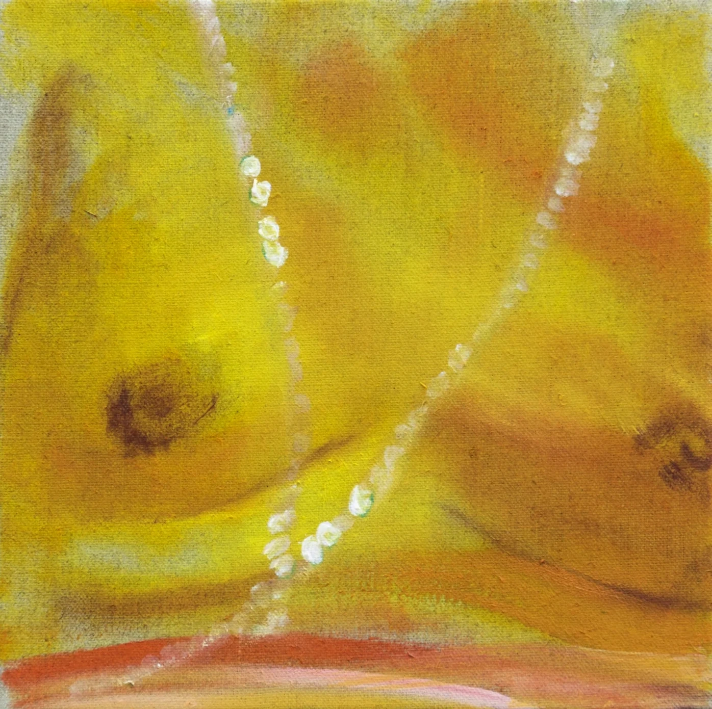 Close view of a pearl necklace across a yellow and orange figure